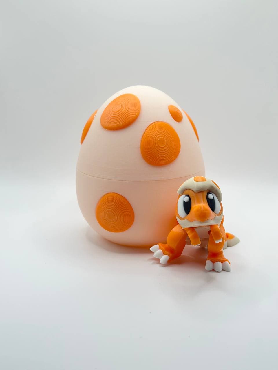 Orange stegosaurus Dino / egg